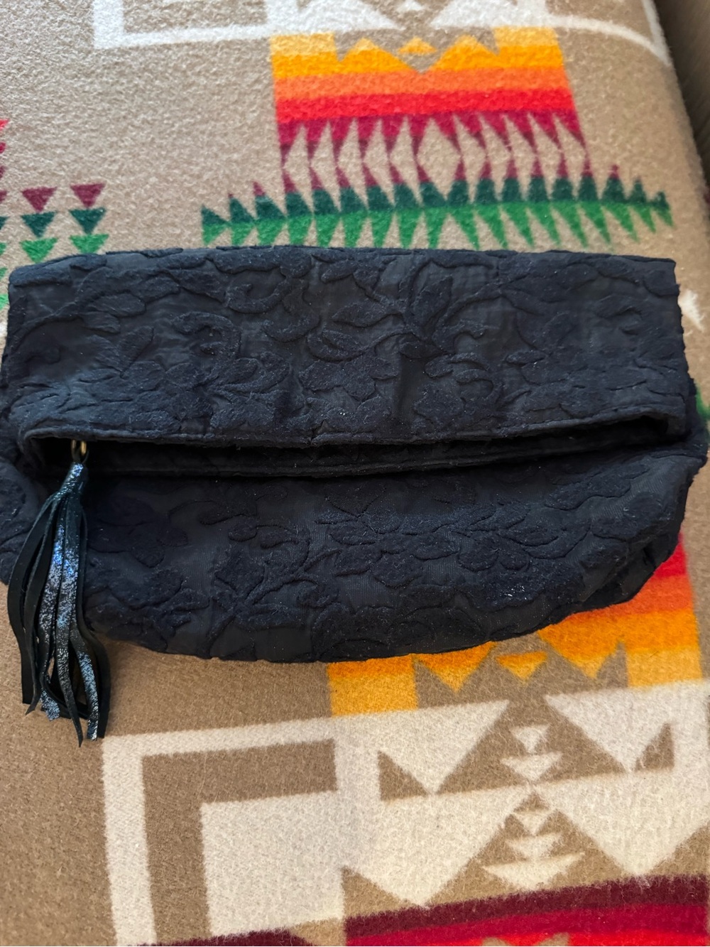 Miss Albright Black Textured Fold-Over Clutch with Tassel Accent